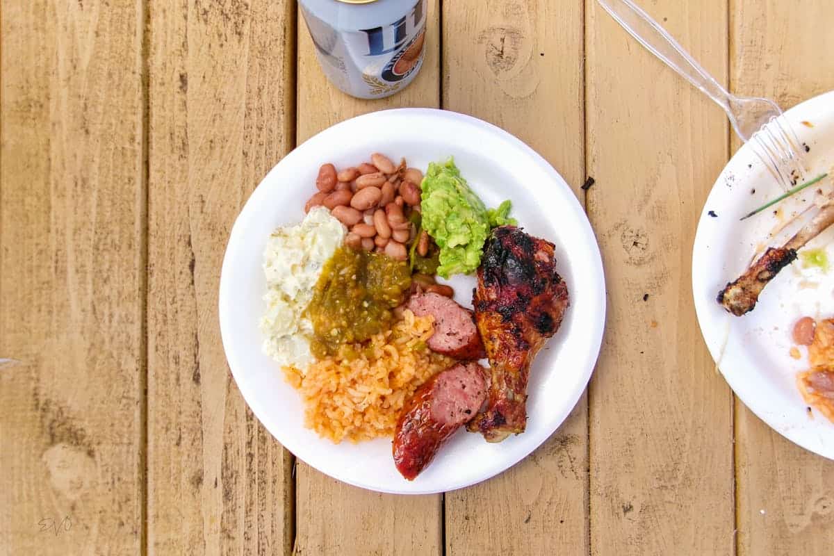 BBQ chicken plate with rice and sides