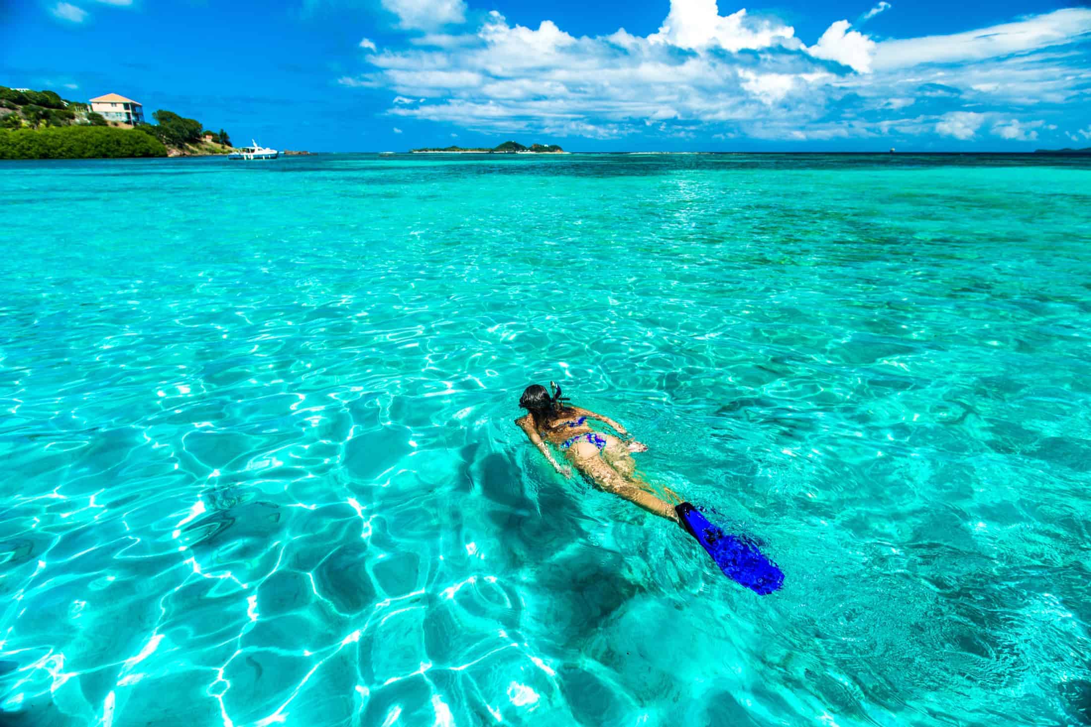 Snorkeling in clear water near Union Island