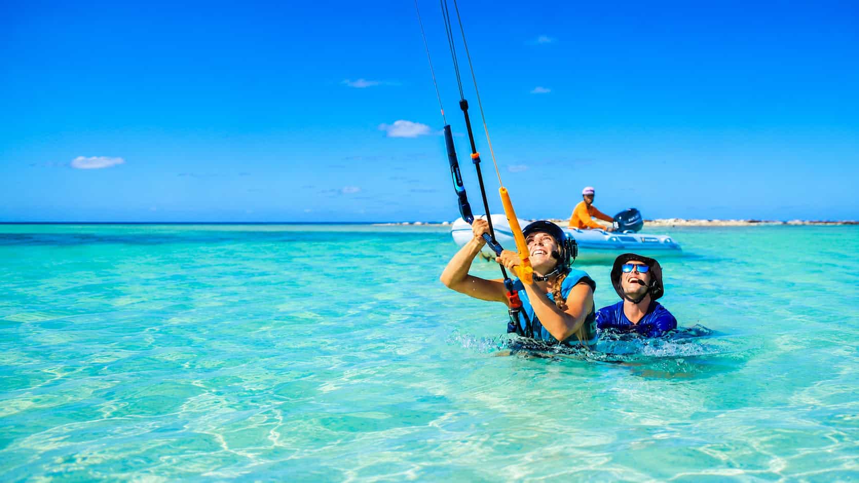 Kitesurf lessons in shallow turquoise Caribbean water with instructor support and safety boat