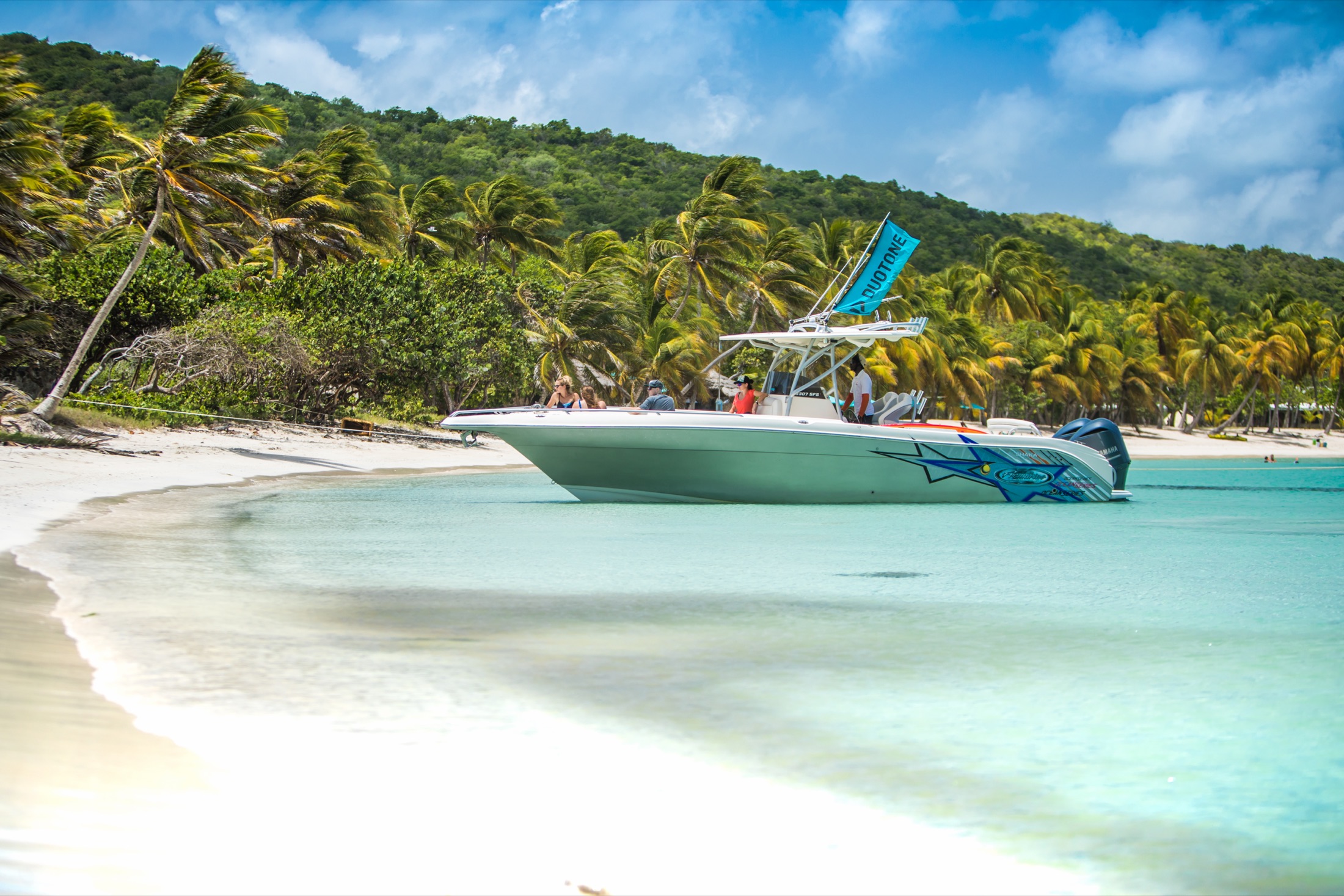 Shaka private boat anchored at a Grenadines beach