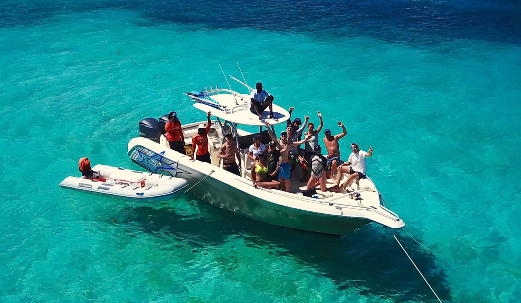 Friends and family enjoying a Grenadines boat trip on clear water