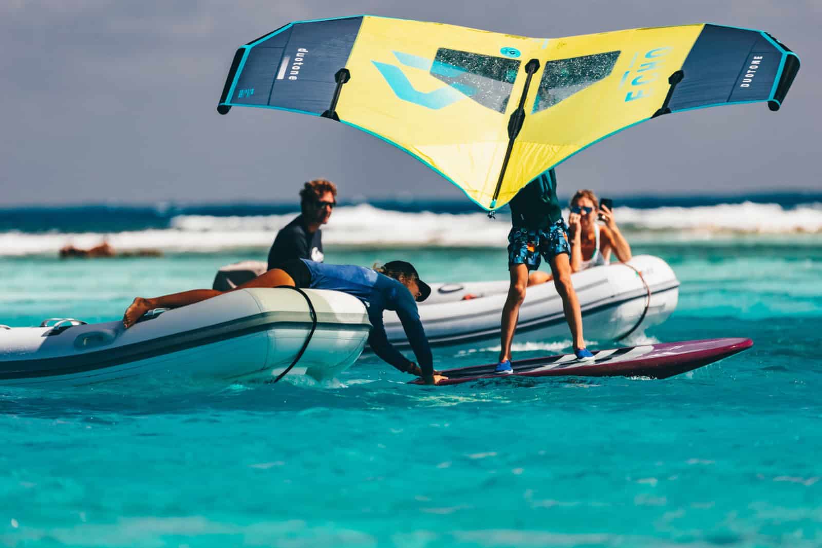 Wing foil lesson from a support boat in shallow Caribbean water